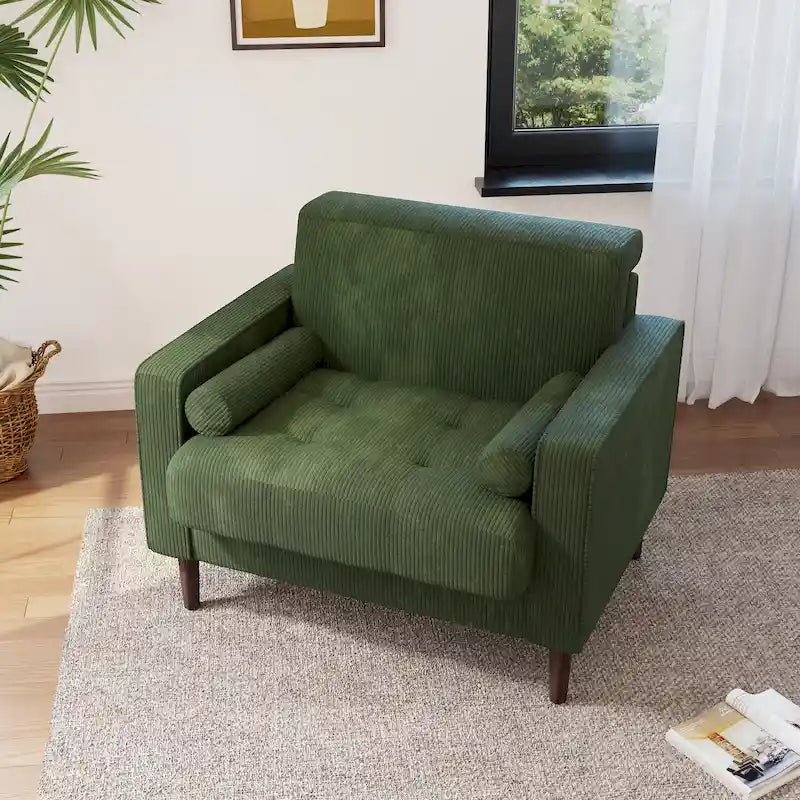 Poltrona moderna imbottita in velluto a coste con braccioli e cuscini